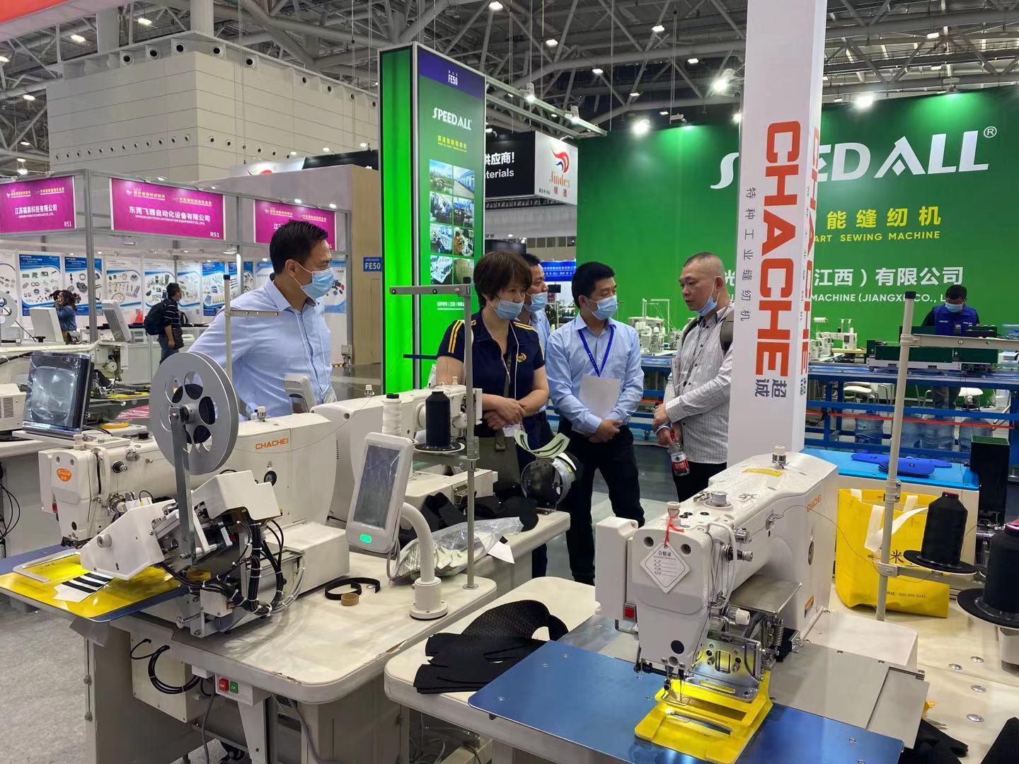 The technician shows the new design shoe sewing machine.